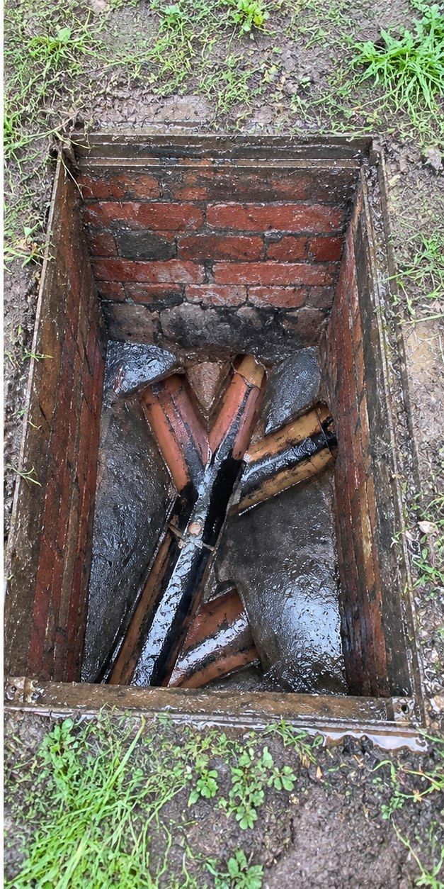 The same drain chamber cleared and flowing